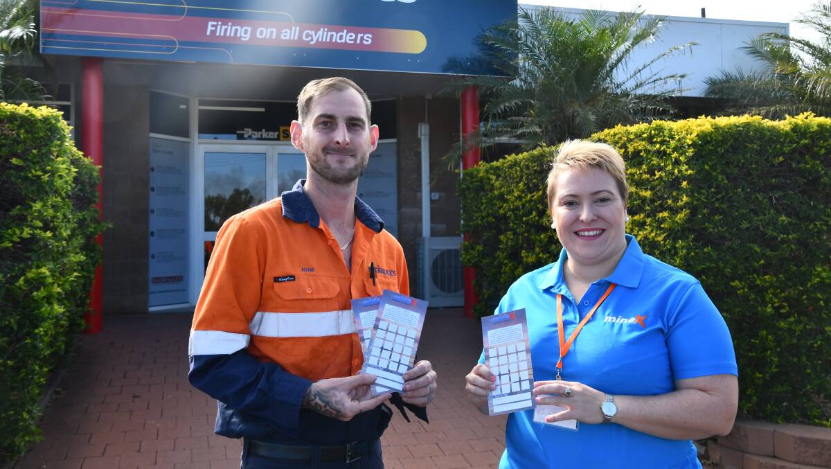 Isadraulics fitter and turner Adam Murr and MineX event organiser Beth Anderson show off the buyer passports.