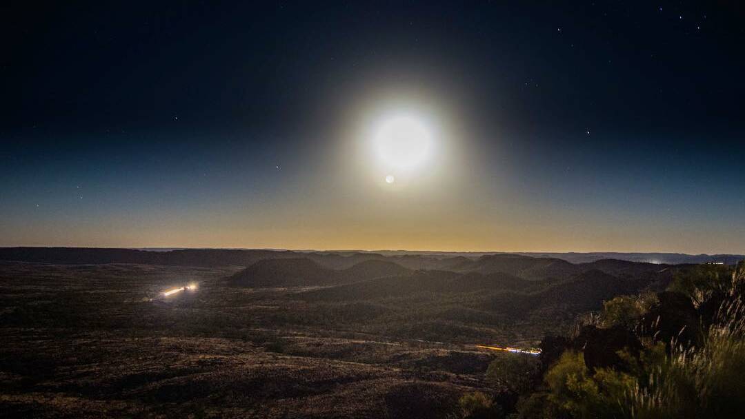 FUNNY MOON: Local photographer Richard Norris captured this great photo of the supermoon over Mount Isa on Monday night.