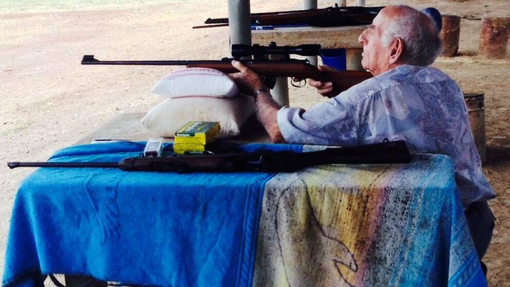 SAD LOSS: Frank Koitka tries out a 22 Rimfire rifle during the Mount Isa Branch Sporting Shooters Association of Australia military competition in 2014.