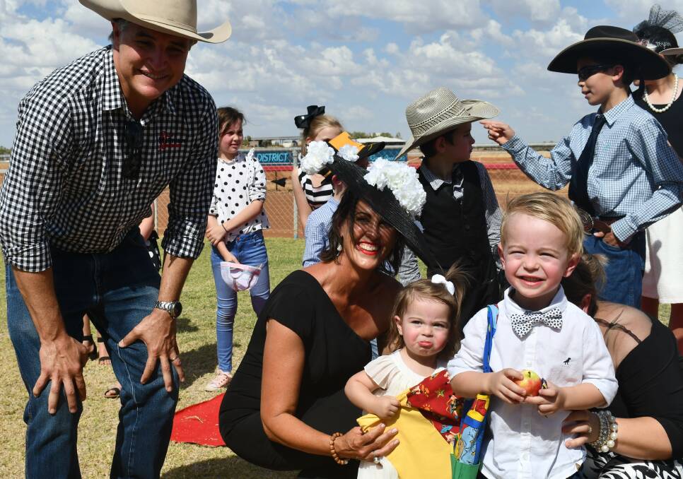 CUTE: Cloncurry races fashion judges Robbie Katter and Susan Dowling ward best dressed under fives to siblings Pippa and Monty. Photo: Derek Barry