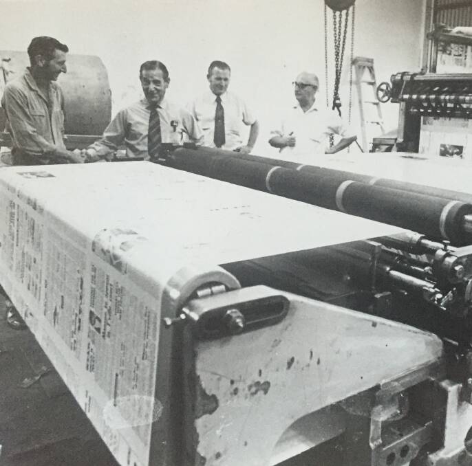 HOT PRESS: Sir Asher Joel (second from the left) and staff examine the new press of the North West Star.