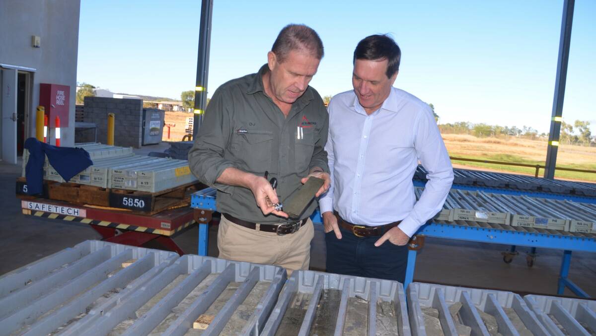 Aeon Resources Dan Johnson shows a Walford Creek core sample to Mines Minister Dr Antony Lynham.