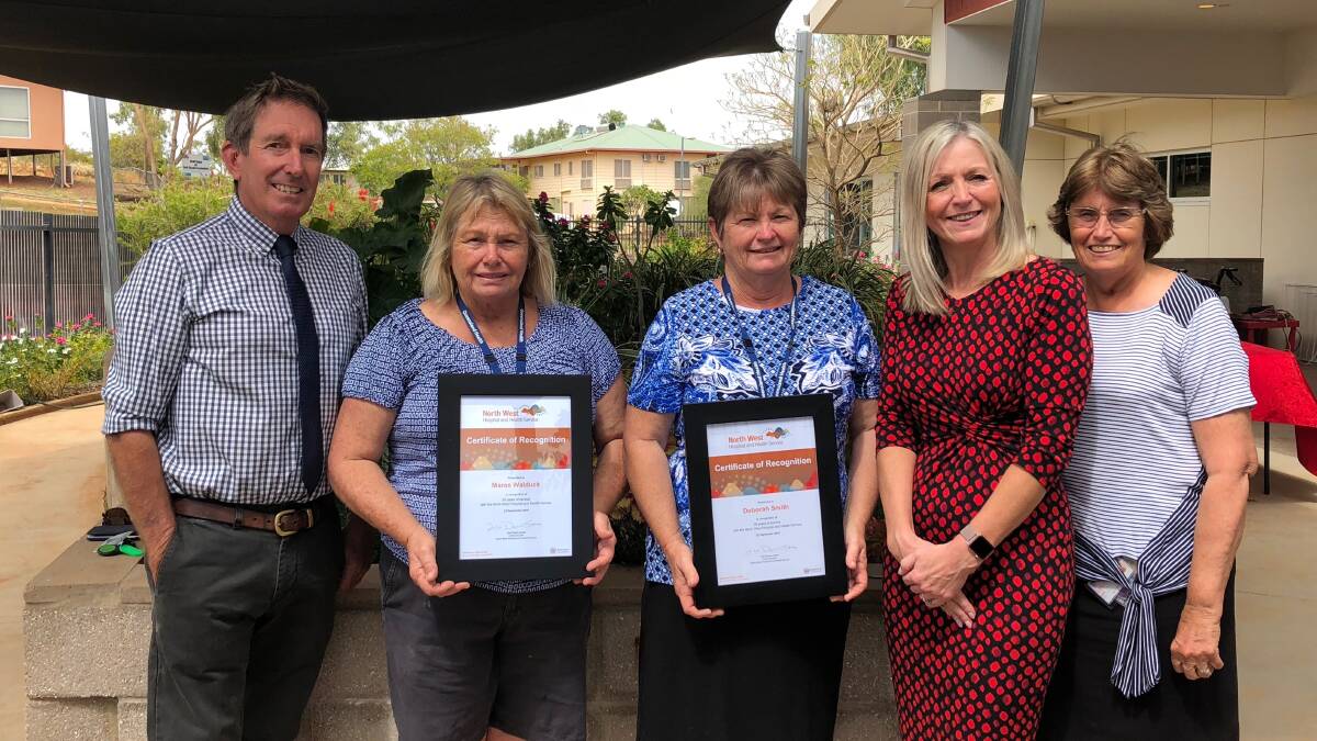 The sisters with board chair Paul Woodhouse, CEO Lisa Davies Jones and Cloncurry DON Leslie Laffey.