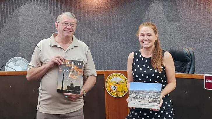 Local historian Barry Merrick presented two books to Mount Isa City Council Mayor Danielle Slade at the January meeting.