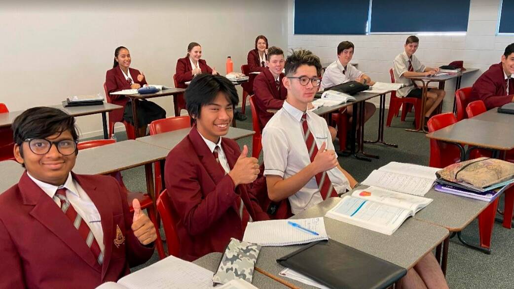Good Shepherd Year 11 math students give a thumbs up to being back in the classroom.