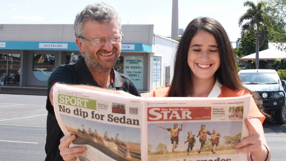 Editor Derek Barry and journalist Lydia Lynch read the North West Star.