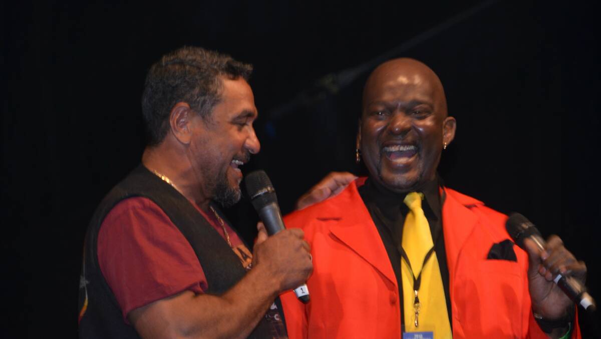 MUSIC MAESTRO: Gulf Frontier Days organiser Alec Doomadgee shares a laugh on stage with MC Wylie J. Photo: Derek Barry