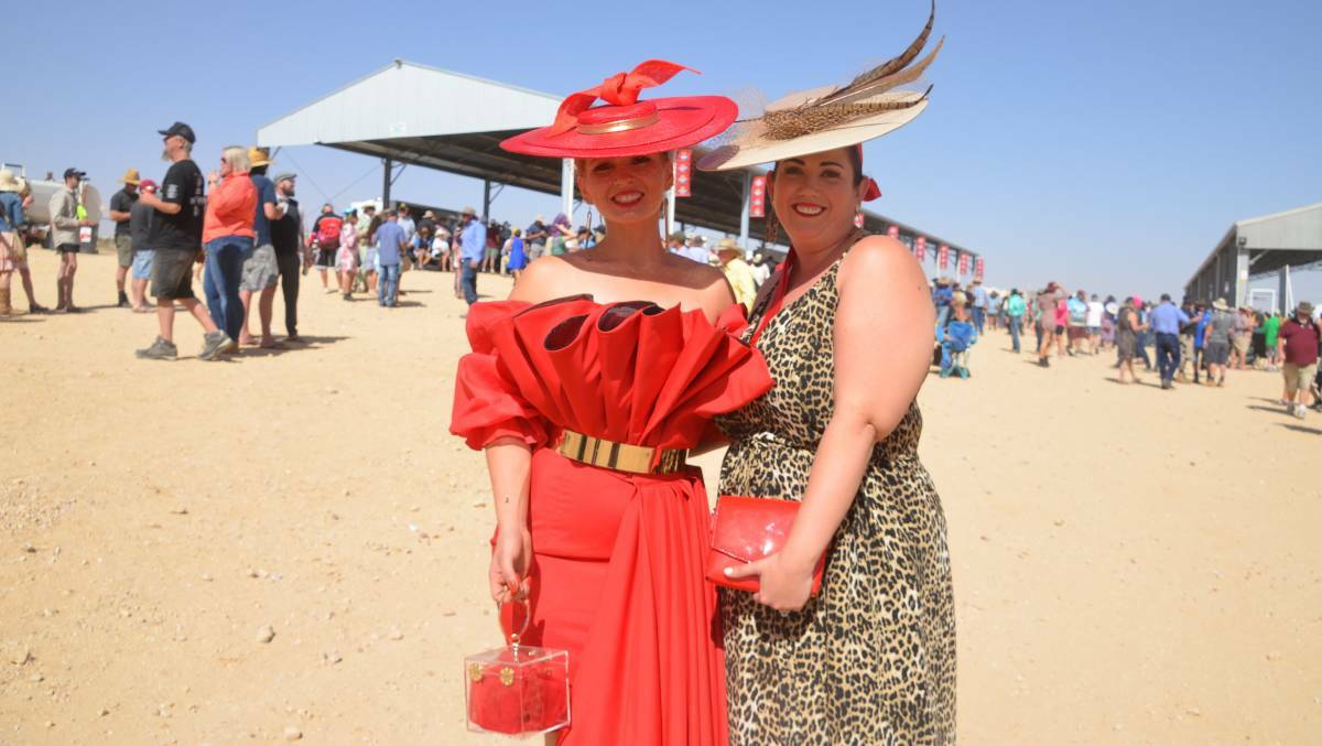 OUTBACK GLAMOUR: Mount Isa's Cheryn Ramsay and Jen Verana cut a dash at the 2019 Birdsville Cup races. Photo: Derek Barry