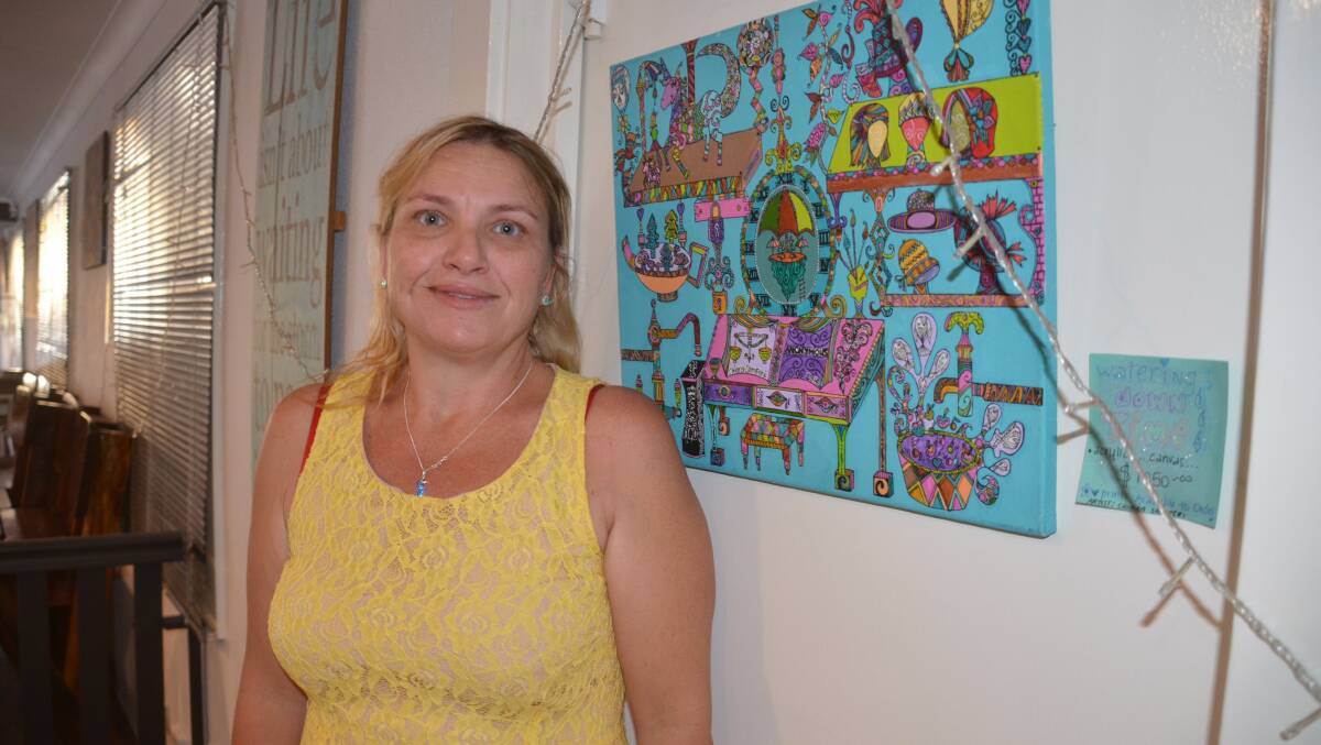 Chiara Samperi with one of her pieces hanging at Arvo's - Watering Down Time.