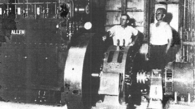 The Allen diesel engine at Mount Isa, Norm Smith on the left.