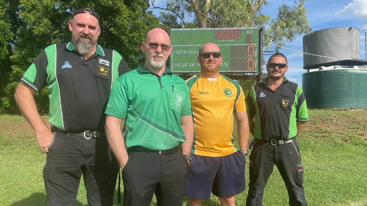 Inspecting the new rugby union scoreboard are Shaine Hunter, Bernard Gilic, Justin Nielsen and Roman Schmidt.