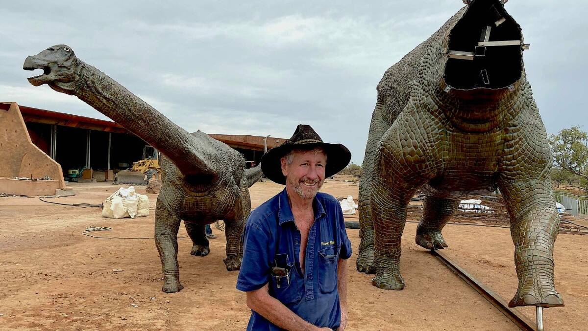Executive Chairman of the Australian Age of Dinosaurs Museum, David Elliott with two of the bronze dinosaurs. Photo: John Elliott.