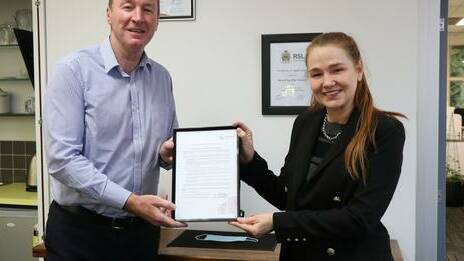 Mount Isa City Council CEO David Keenan and Mayor Danielle Slade with the signed Welcoming Cities commitment.
