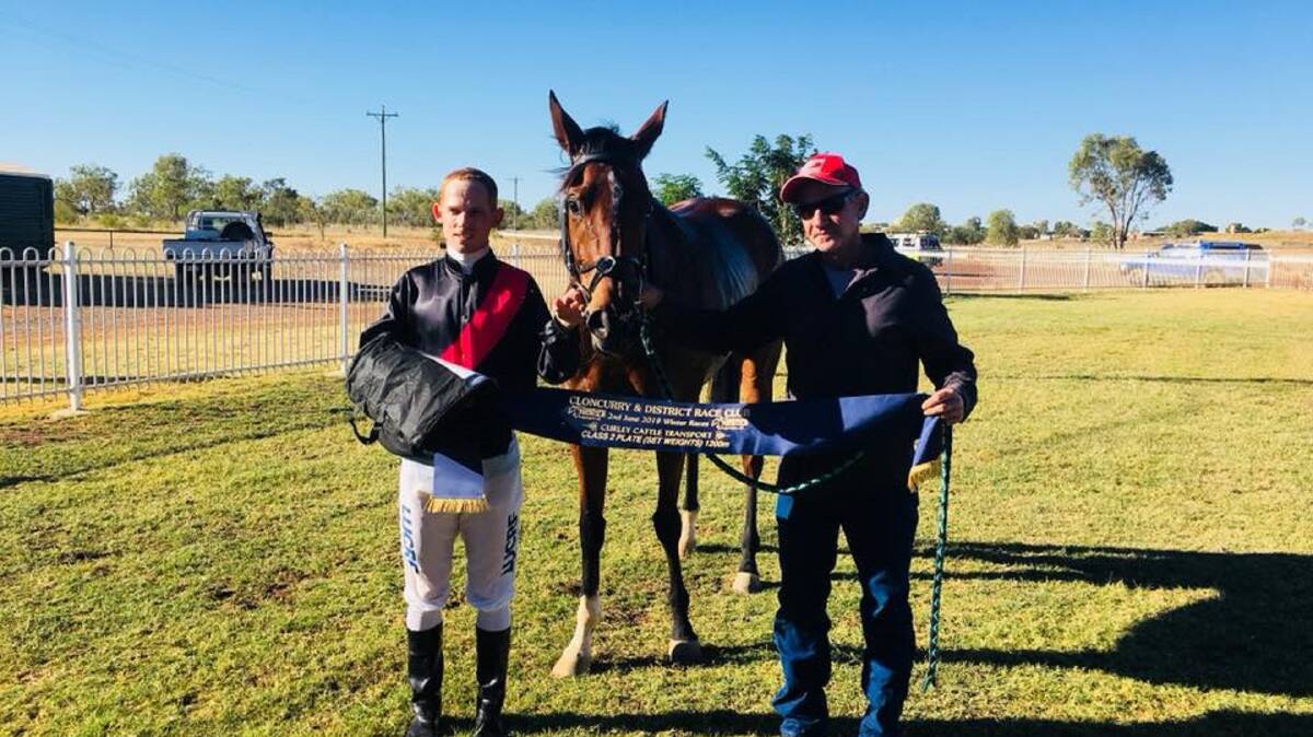 Jockey Dan Ballard and trainer Damien Finter won the Curley Cattle Transport Class 2 Plate with Slithering Suzie. Photo: Cloncurry Race Club