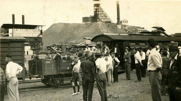 Mount Isa in 1933 as striking mine workers wait for the train.Photos courtesy of Barry Merrick/Merryn Parnell family album 
