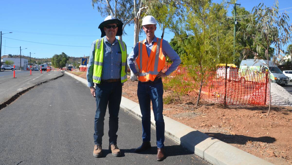 ROAD WORKS: BMD project manager Anthony Burke and Transport and Main Roads minister Mark Bailey inspect the Barkly Hwy roadworks in Mount Isa on Friday. 