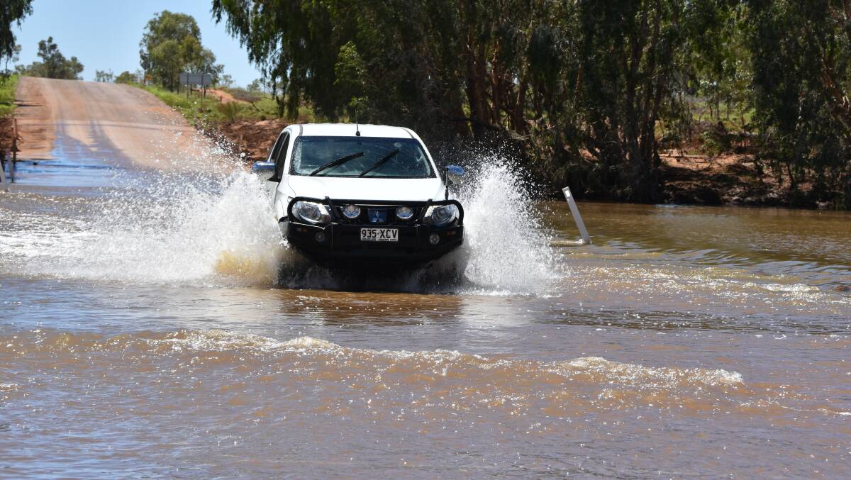 The causeway over the Cloncurry River is reopen with caution with water over the road.