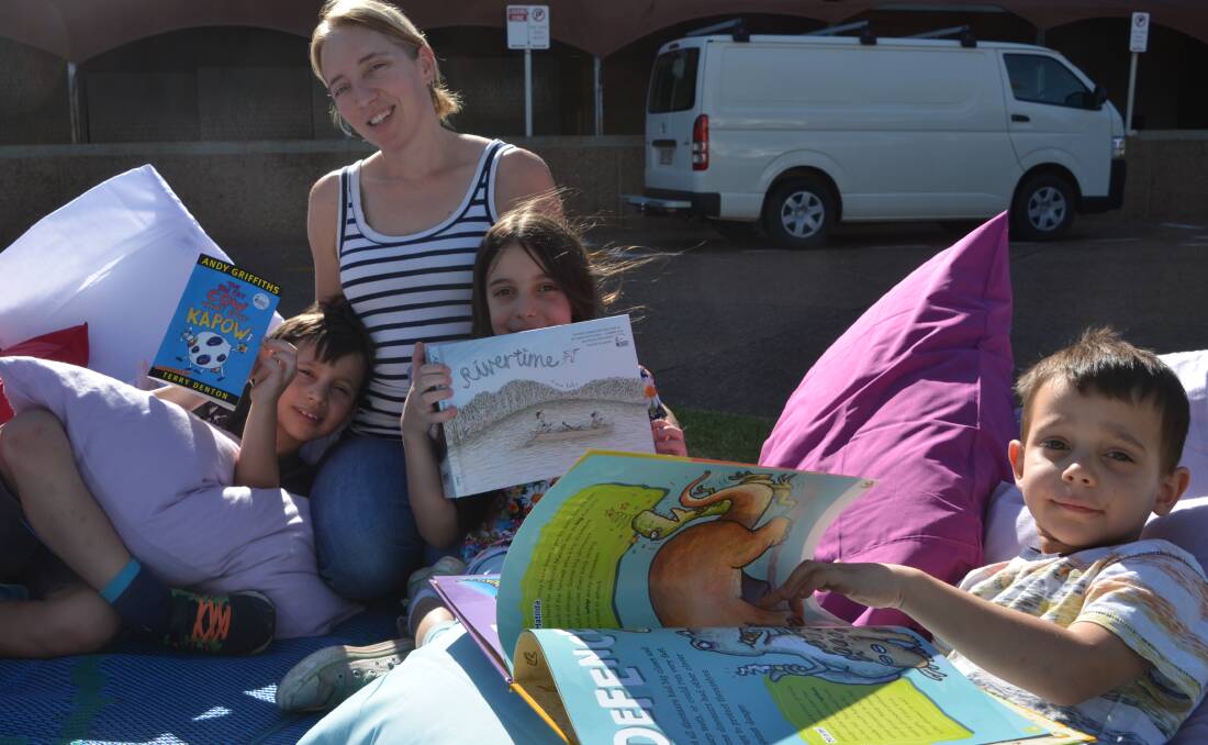 PILLOW FUN: Enjoying the literacy event on the Mount Isa Civic Centre lawn on Monday are the Botha family: Benjamin, Vicky, Michelle and Jamie. Photo: Derek Barry