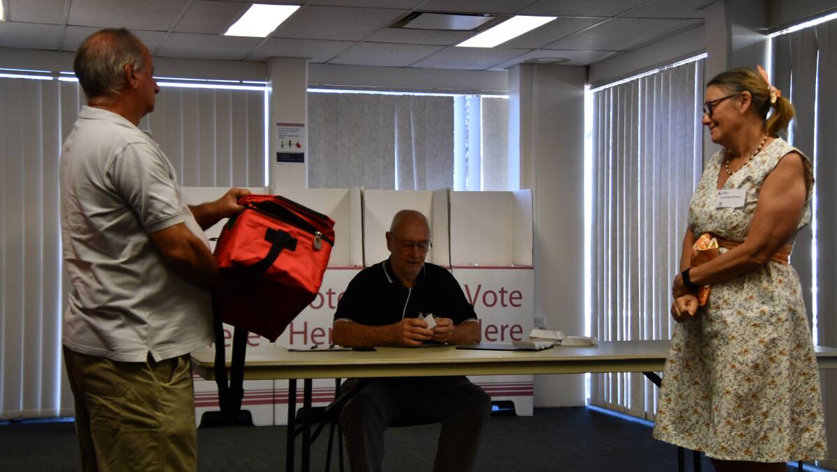 Electoral officer Paul Sutton (seated) conducts the Traeger ballot draw.