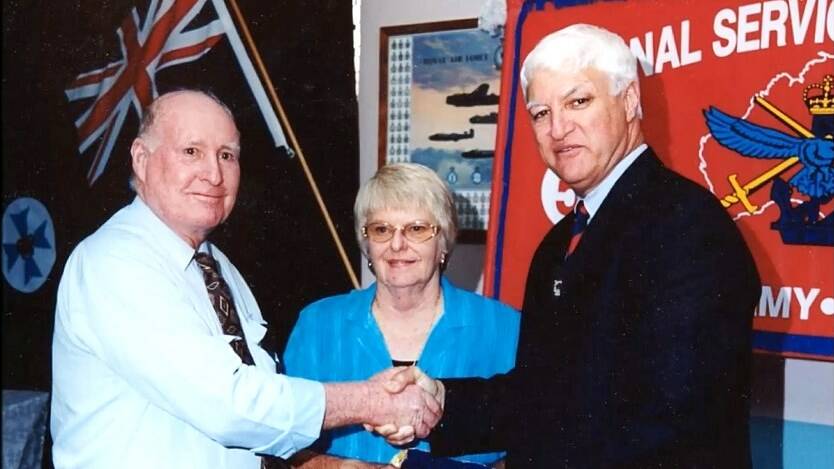 Bob Katter presents Arthur Hanson with his National Service medal in 2002 at the Atherton RSL while Jess Ahlers looks on.