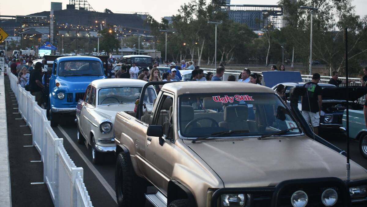 Cars on parade during the new Isa St Bridge opening.