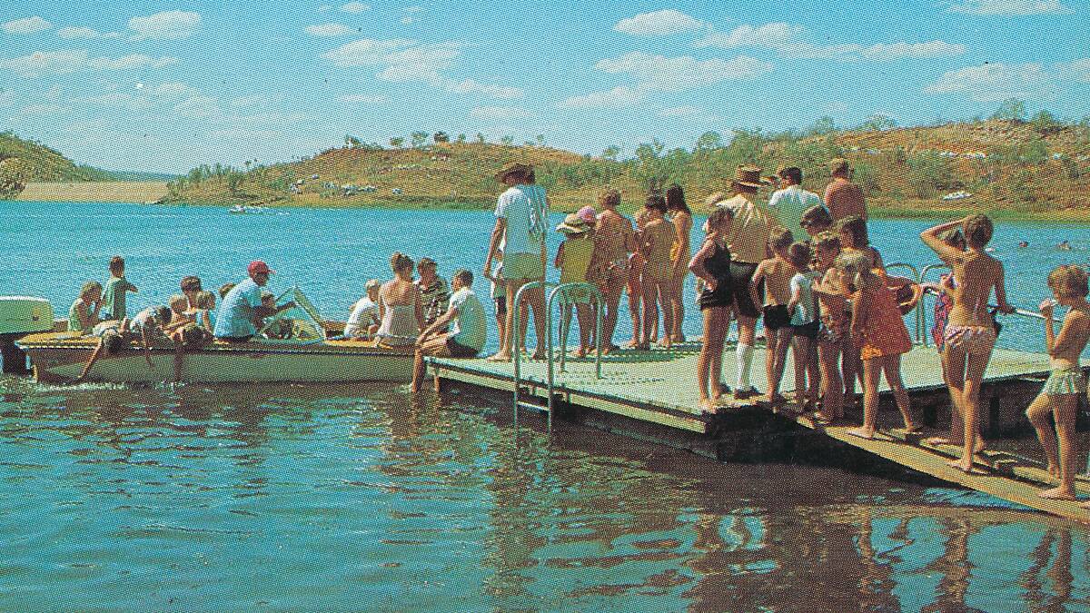Children queue up for a boat ride on Lake Moondarra in the 1970s.