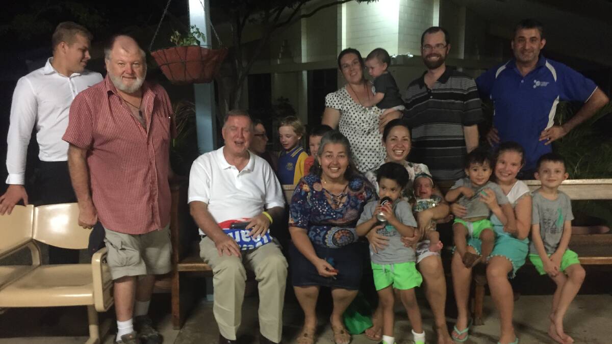 Friends of Father Mick Lowcock celebrate his 25 years in Mount Isa at a barbecue on Thursday night.