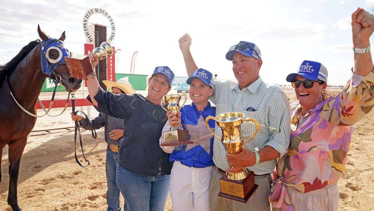 Trainer Todd Austin, jockey Brooke Richardson and connections of Echo Point celebrate their Birdsville Cup win.