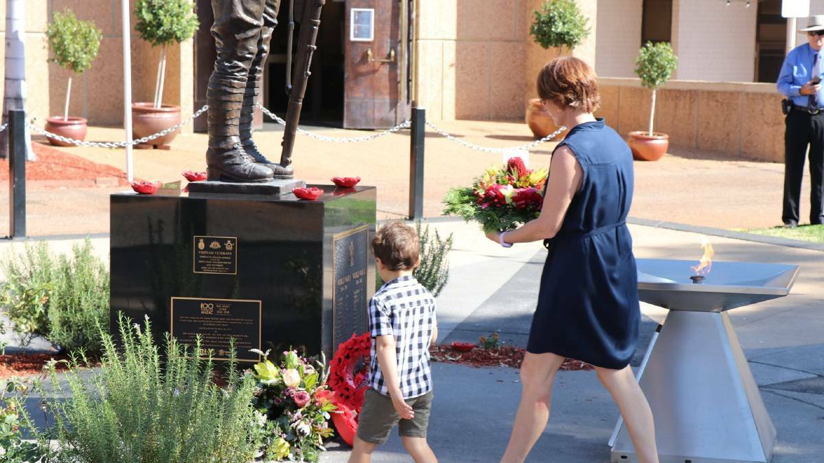 Attendees lay a wreath at the 2019 Mount Isa Vietnam Veterans Day service.