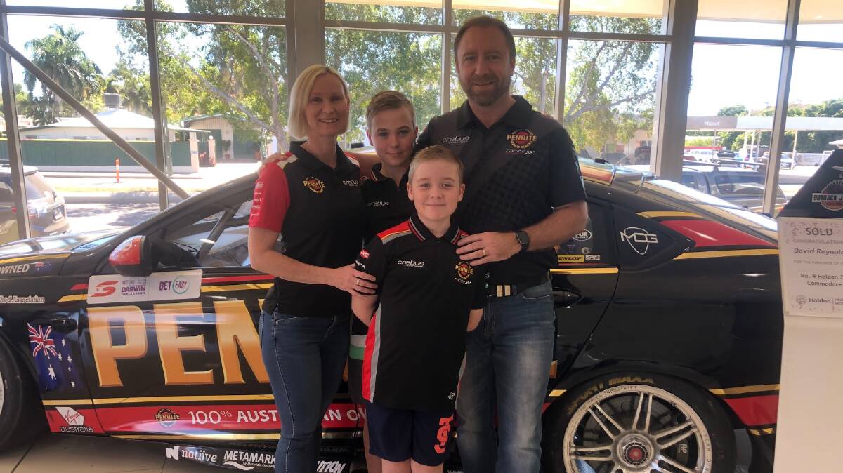FLASH CAR: Paul, Tanya, Dustin and Jett Malouf with David Reynolds' Holden at Malouf Holden Mount Isa.