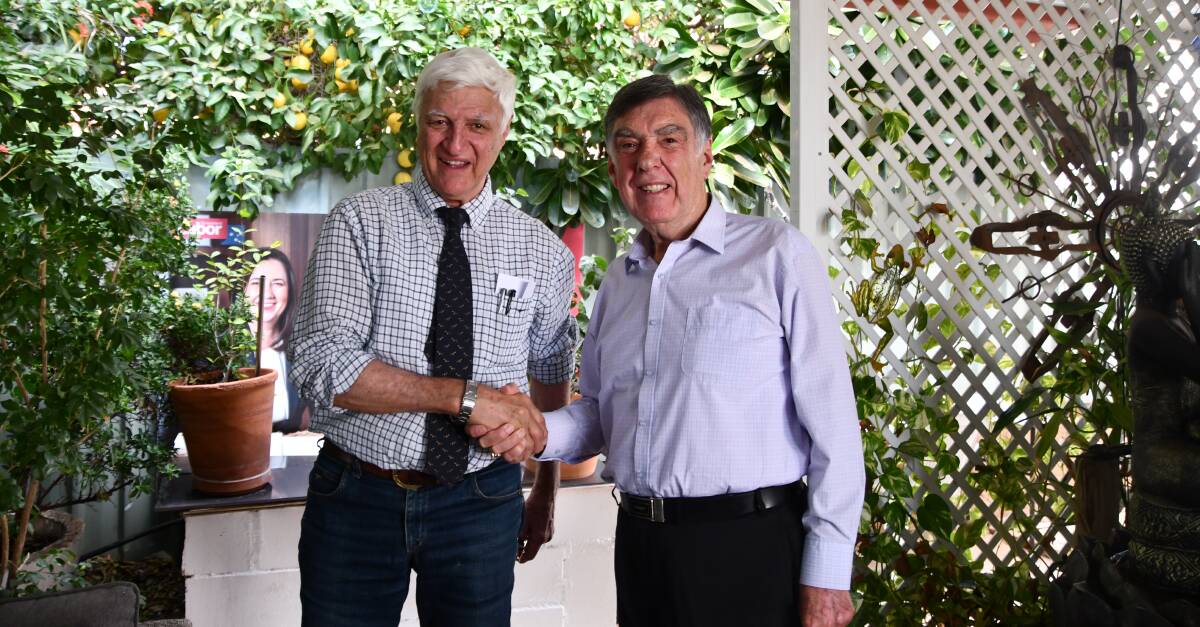 Bob Katter and Tony McGrady have shaken hands on something they both agree - keeping the Mount Isa Mines copper operation going into the future. Photo: Derek Barry