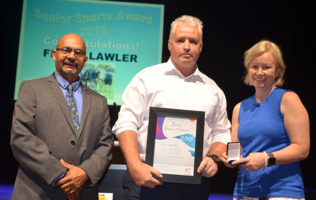 DESERVING: Frank Lawler receives the Mount Isa Sportsperson of the year award from Crs George Fortune and Peta MacRae. Photo: Derek Barry