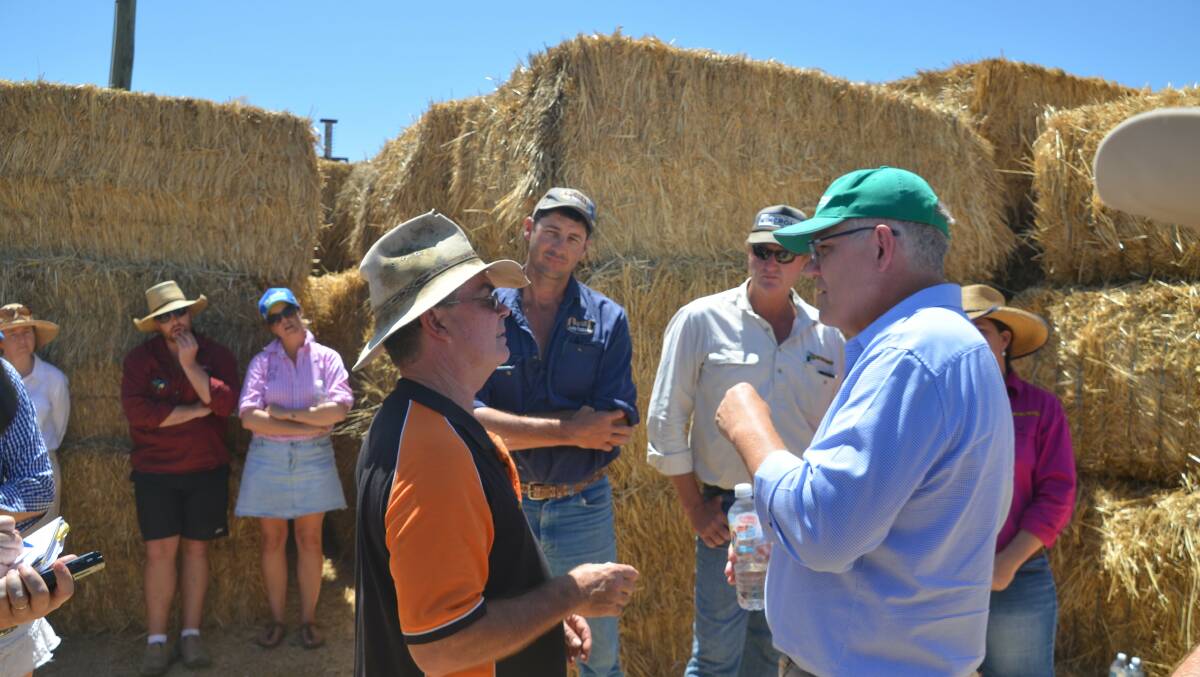 PM Scott Morrison speaks with Julia Creek businessman Phil Alexander in his visit to the region last week.