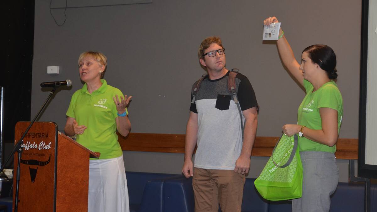Rebecca Lister and Lynette Stenhouse of Headspace use Joel Pate from the audience to "weigh him down with worries" at the breakfast last Tuesday.