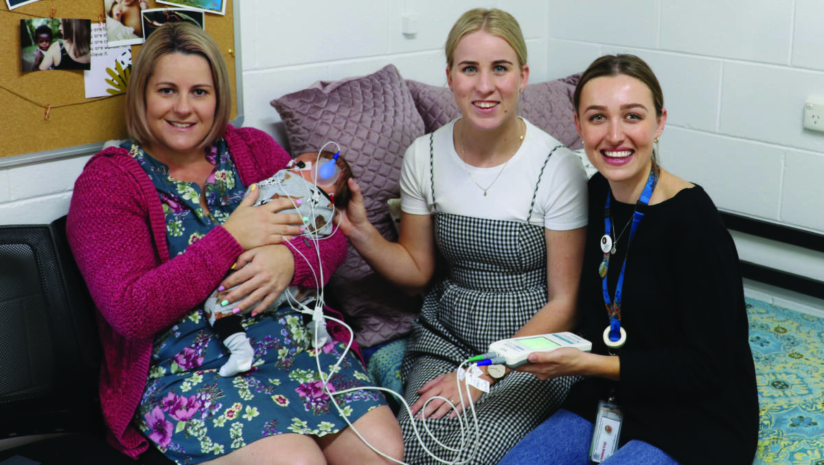 New Mum Robyn Hardy with registered midwives Christie Luke and Madeleine Beavis putting the new hearing device to the test. Photo: supplied