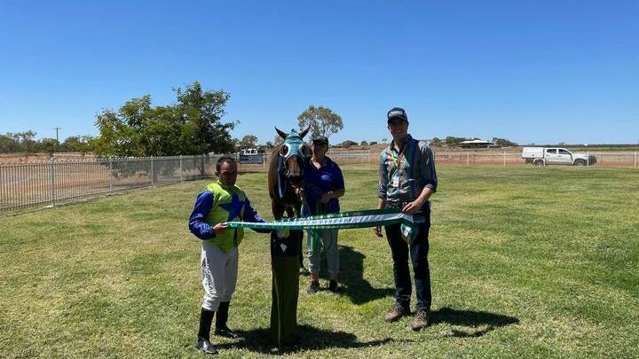 Beat the Heat Benchmark 45 Handicap winner Faith And Love with jockey Matthew Gray and trainer Philip Cole. Photo: Cloncurry and District Race Club.
