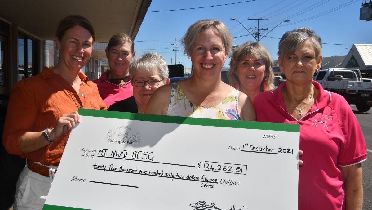 Belinda Murphy (left) and Edwina Hick (third right) of Women of the West donate a cheque to North West Breast Cancer support group (L-R) Gayle Stead, Coral Lynch, Sue Reinke and Robyn Moloney.