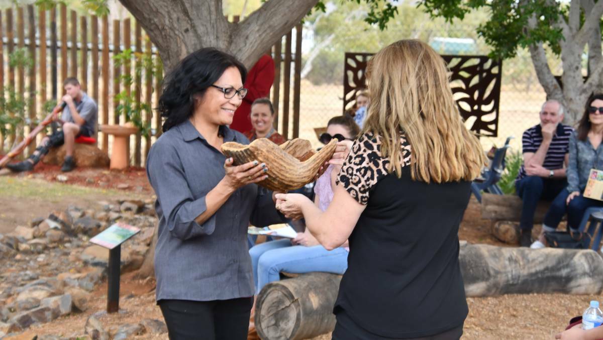A ewer of holy water was passed around as a symbolic gesture to open the St Kieran's Reconciliation Garden.