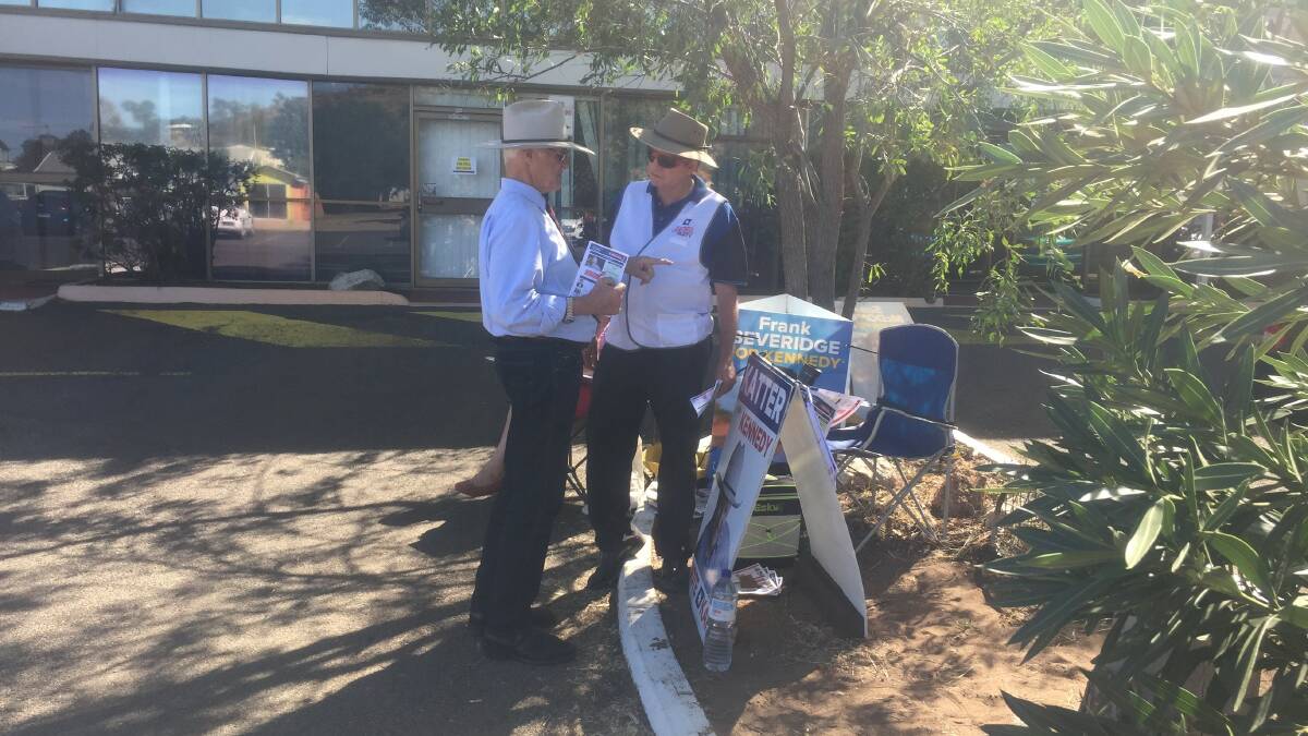Bob Katter chats with a party volunteer at the Mount Isa pre-poll centre.