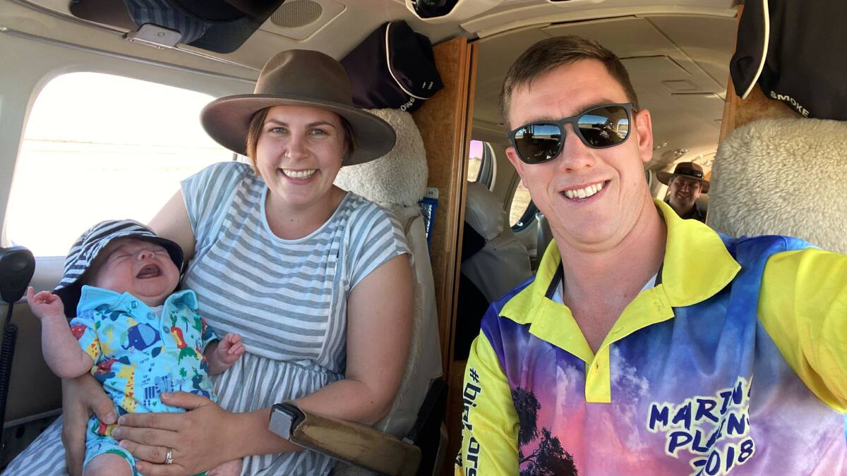 Ebony and Joe Robertson with son Ollie take a chance to see inside the RFDS aircraft.