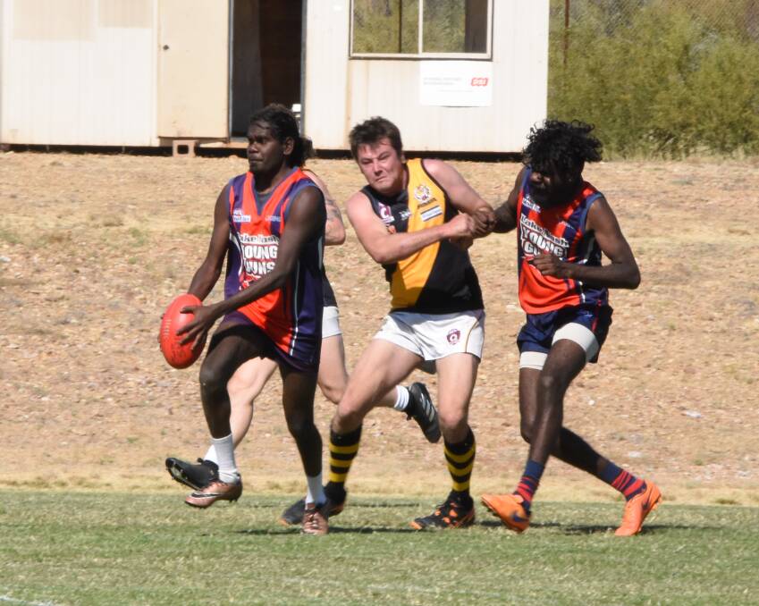 BUSH BATTLERS: Lake Nash Young Guns take a 600km round trip to play in Mount Isa each weekend and often rely on a catching a kangaroo for food on the journey. Photo: Melissa North