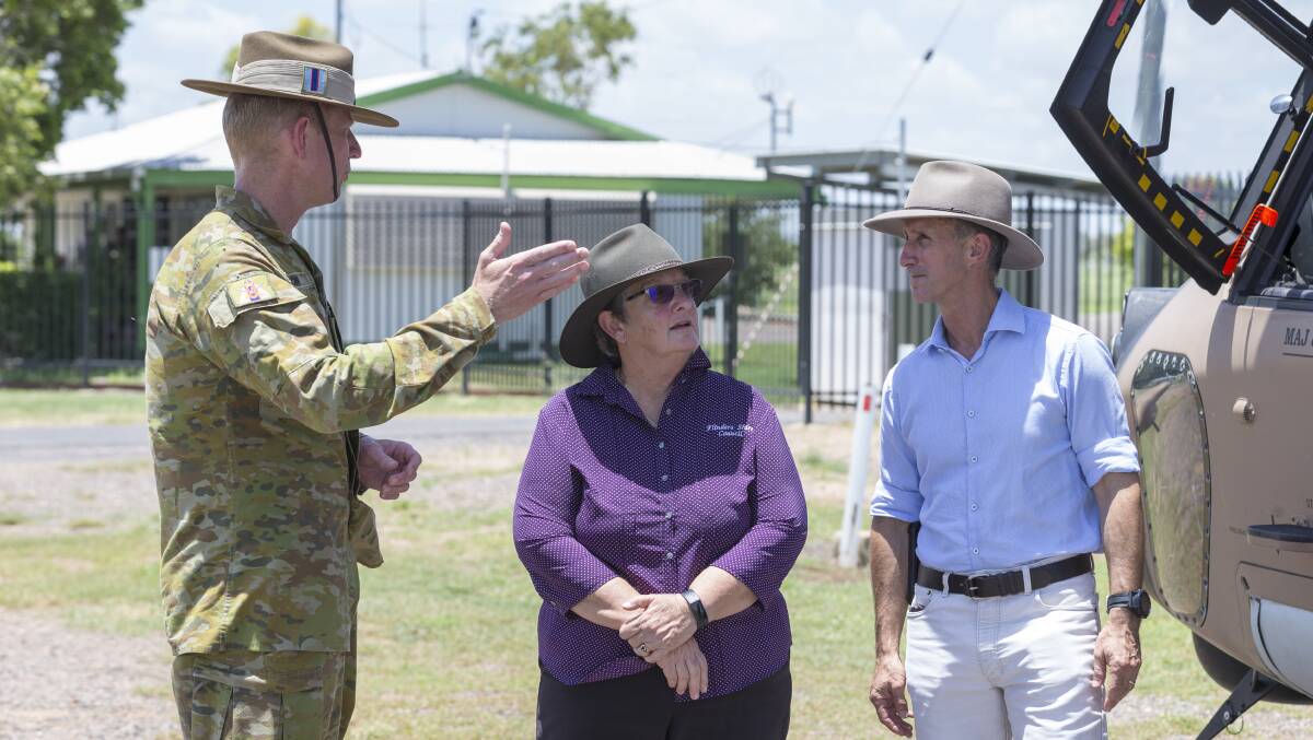 Brigadier Stephen Jobson, Flinders Mayor Jane McNamara and state disaster recovery coordinator Stuart Smith meet in Hughenden.