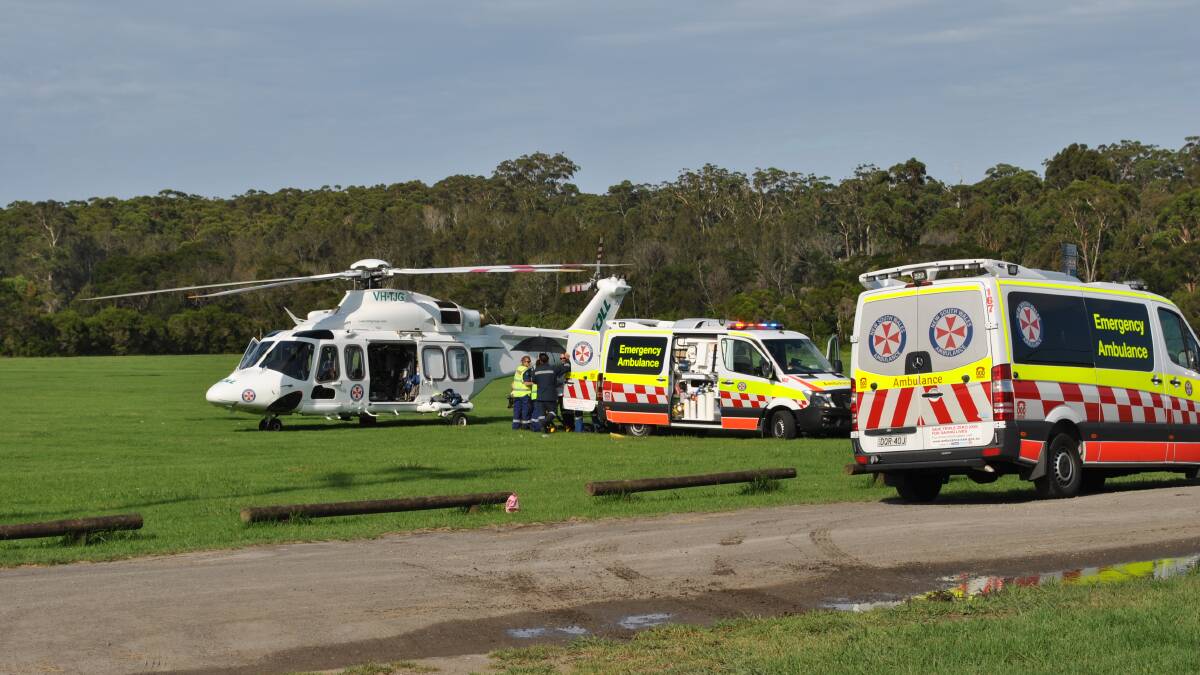 Emergency services prepare the female patient to be airlifted to hospital. Photo: Jessica McInerney.