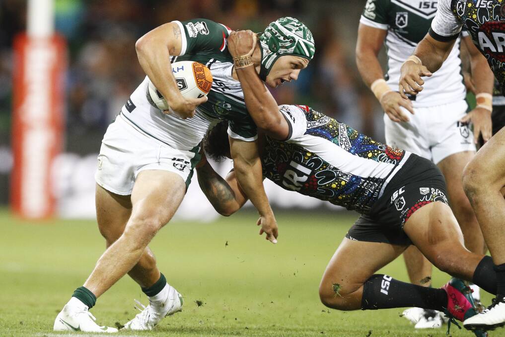 COLLARED: Kalyn Ponga about to be wrestled to the ground during Friday night's All Stars game at AAMI Park in Melbourne. Picture: AAP.