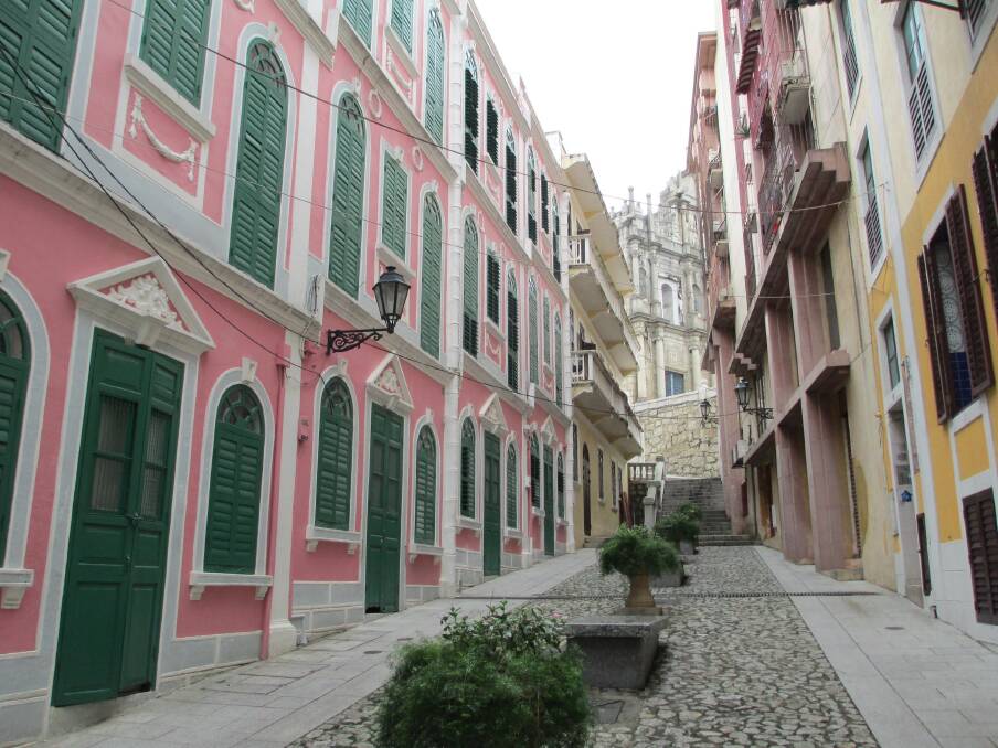 Macao: An unusual view of Macao's famous ruins of St Paul's from a nearby sidestreet.