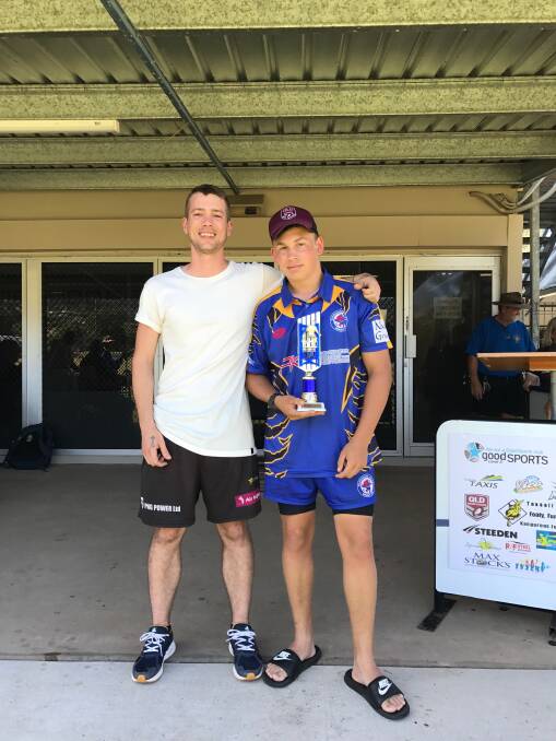 Nick Tassell congratulates Jake Egan, who won player of the tournament at the Tommy Tassell Challenge.