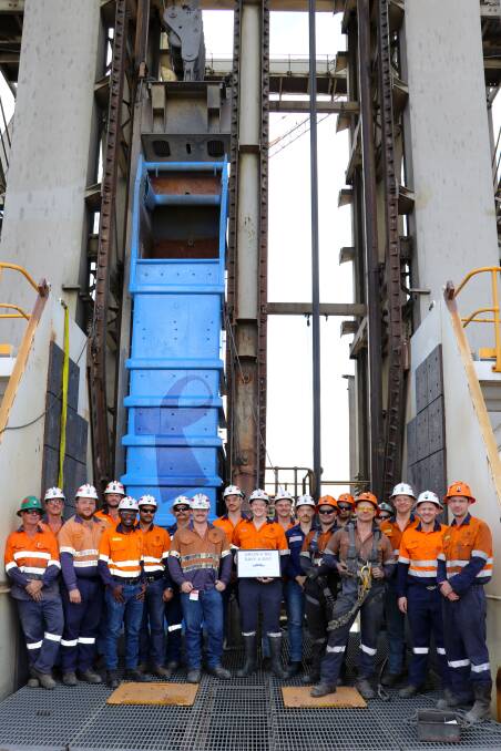 GREAT CAUSE: Glencore staff are growing moustaches as part of Movember to raise awareness about men's health. A group stand in front of the U62 shaft skip bin, which was painted blue last year to raise awareness about prostate cancer. Photo: Supplied