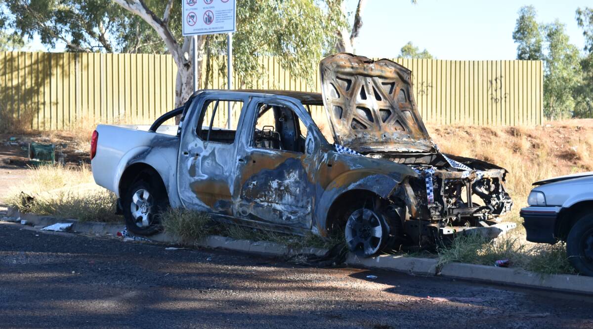 INVESTIGATIONS CONTINUE: A burned out car at Burke Street, pictured on Wednesday. A man is helping police with their investigations after two cars caught fire there. Photo: Hannah Baker