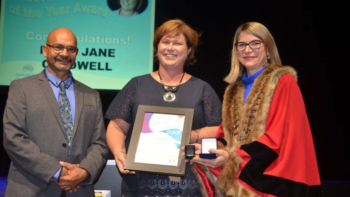 DESERVING WINNER Mary-Jane Caldwell accepts the 2018 Mount Isa Citizen of the Year from Cr George Fortune and Mayor Joyce McCulloch. Photo: Derek Barry