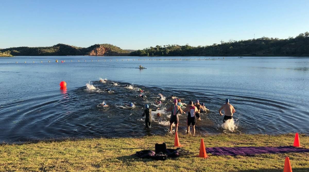 Into the lake: Members of the IsaRATS Triathlon Club are warming up for the racing season.